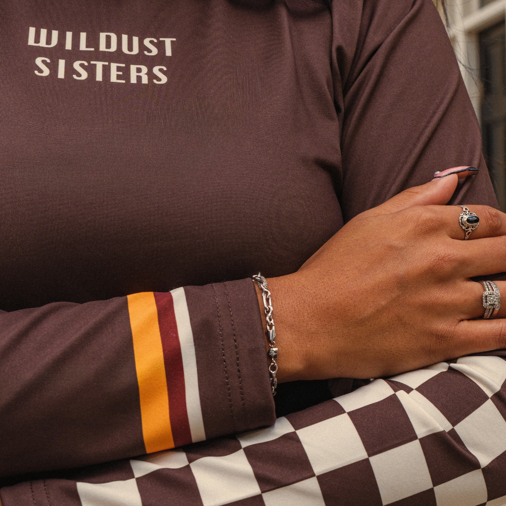 Wildust Sisters Racing Club thermal Lycra top with vintage racing graphics
