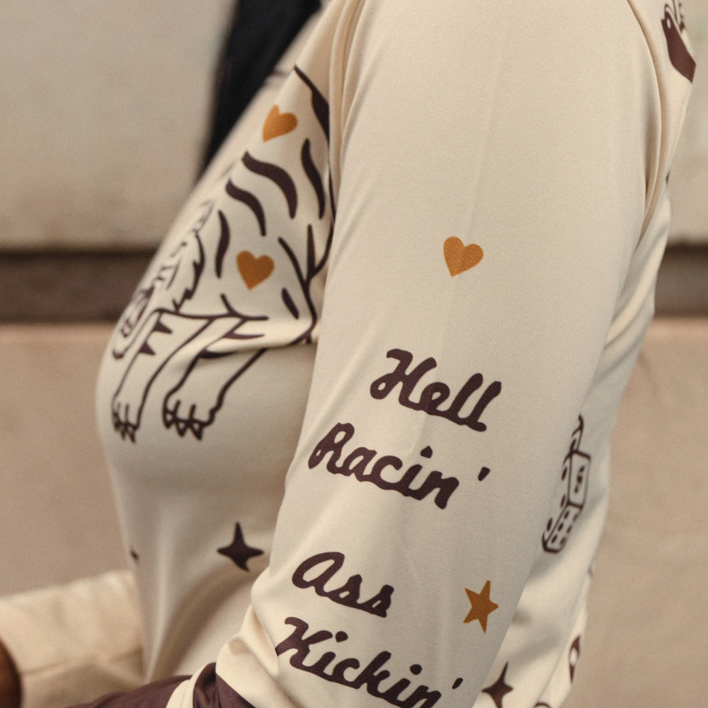 Wildust Sisters Moonchild thermal Lycra top in ecru with tattoo-inspired graphics