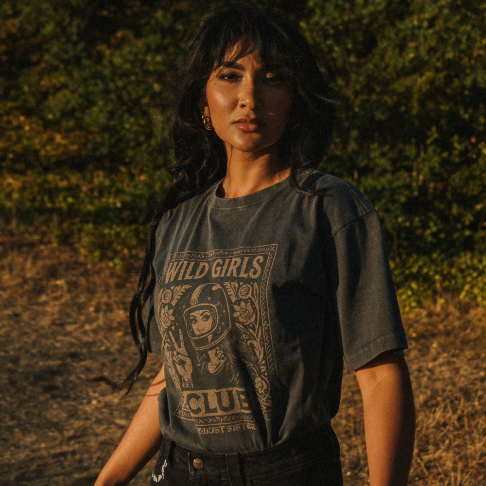 Wildust Sisters Wild Girls Club T-shirt in washed black with a beige front graphic