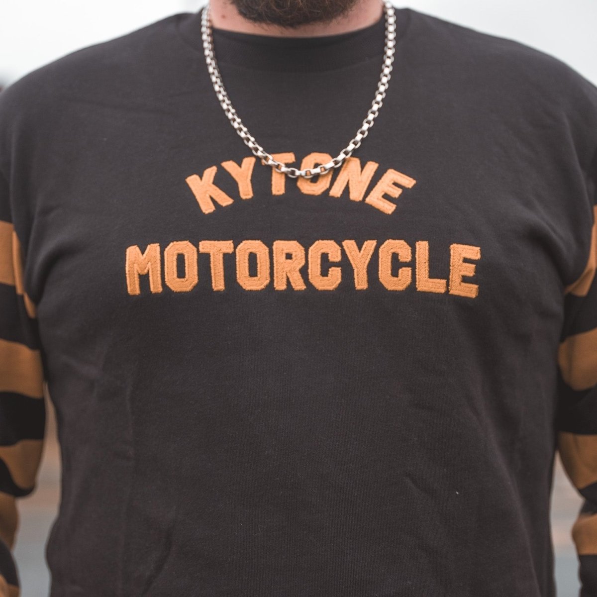 Kytone Bee Sweatshirt in Black and Gold available at Veloce Club