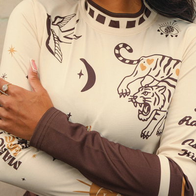 Wildust Sisters Moonchild thermal Lycra top in ecru with tattoo-inspired graphics