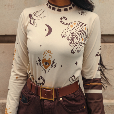 Wildust Sisters Moonchild thermal Lycra top in ecru with tattoo-inspired graphics