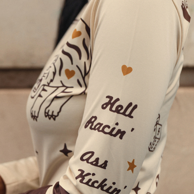 Wildust Sisters Moonchild thermal Lycra top in ecru with tattoo-inspired graphics