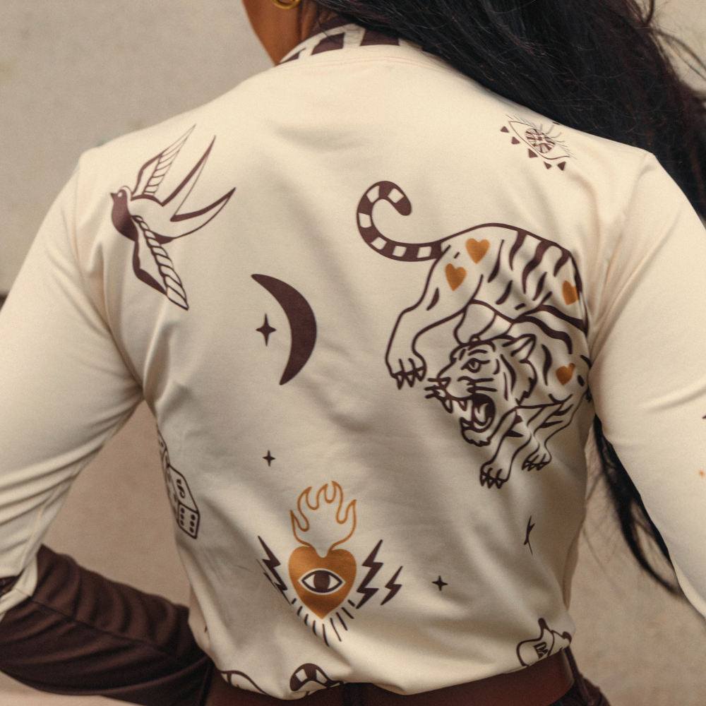 Wildust Sisters Moonchild thermal Lycra top in ecru with tattoo-inspired graphics
