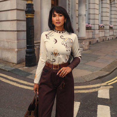 Wildust Sisters Moonchild thermal Lycra top in ecru with tattoo-inspired graphics