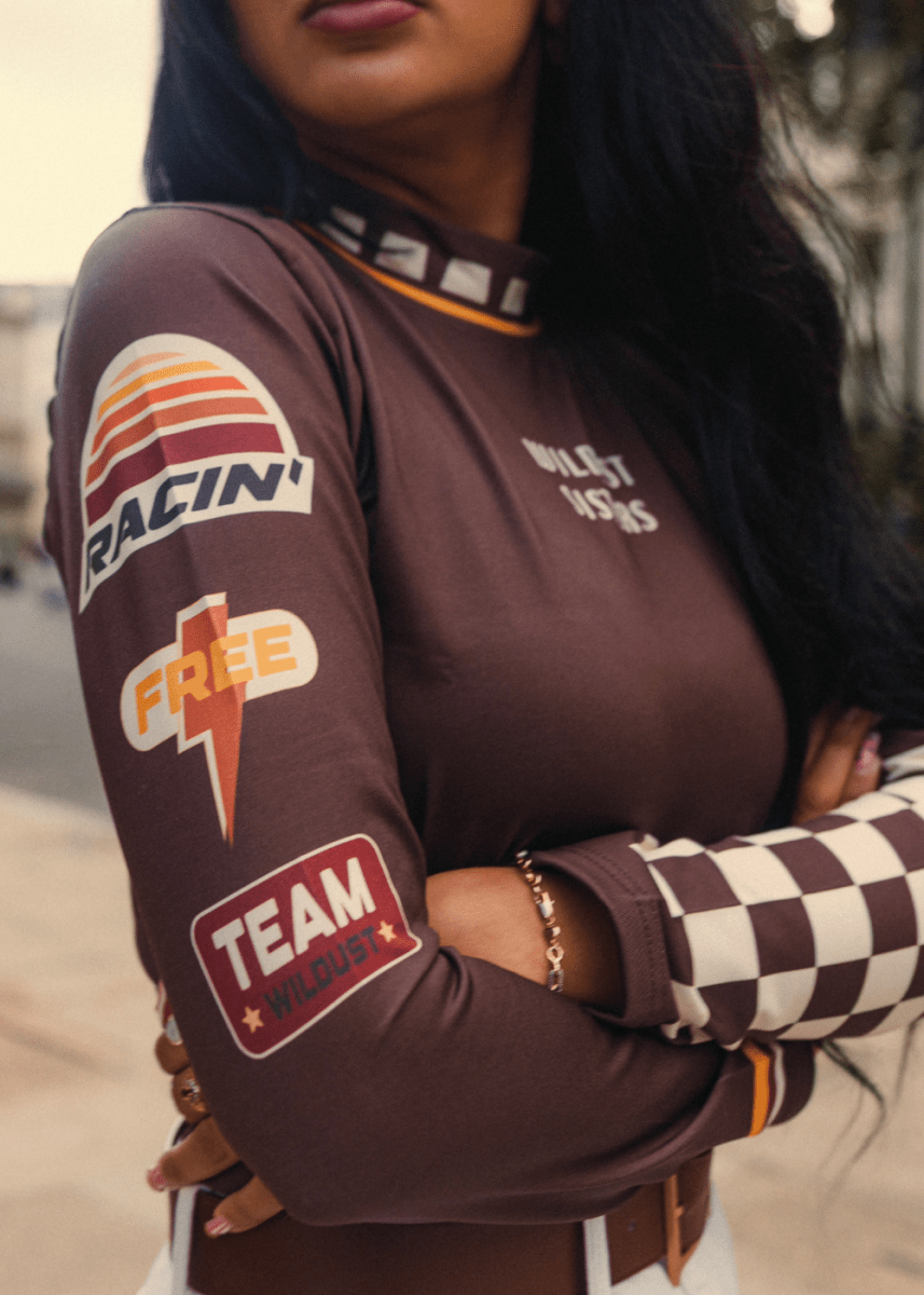 Wildust Sisters Racing Club thermal Lycra top with vintage racing graphics
